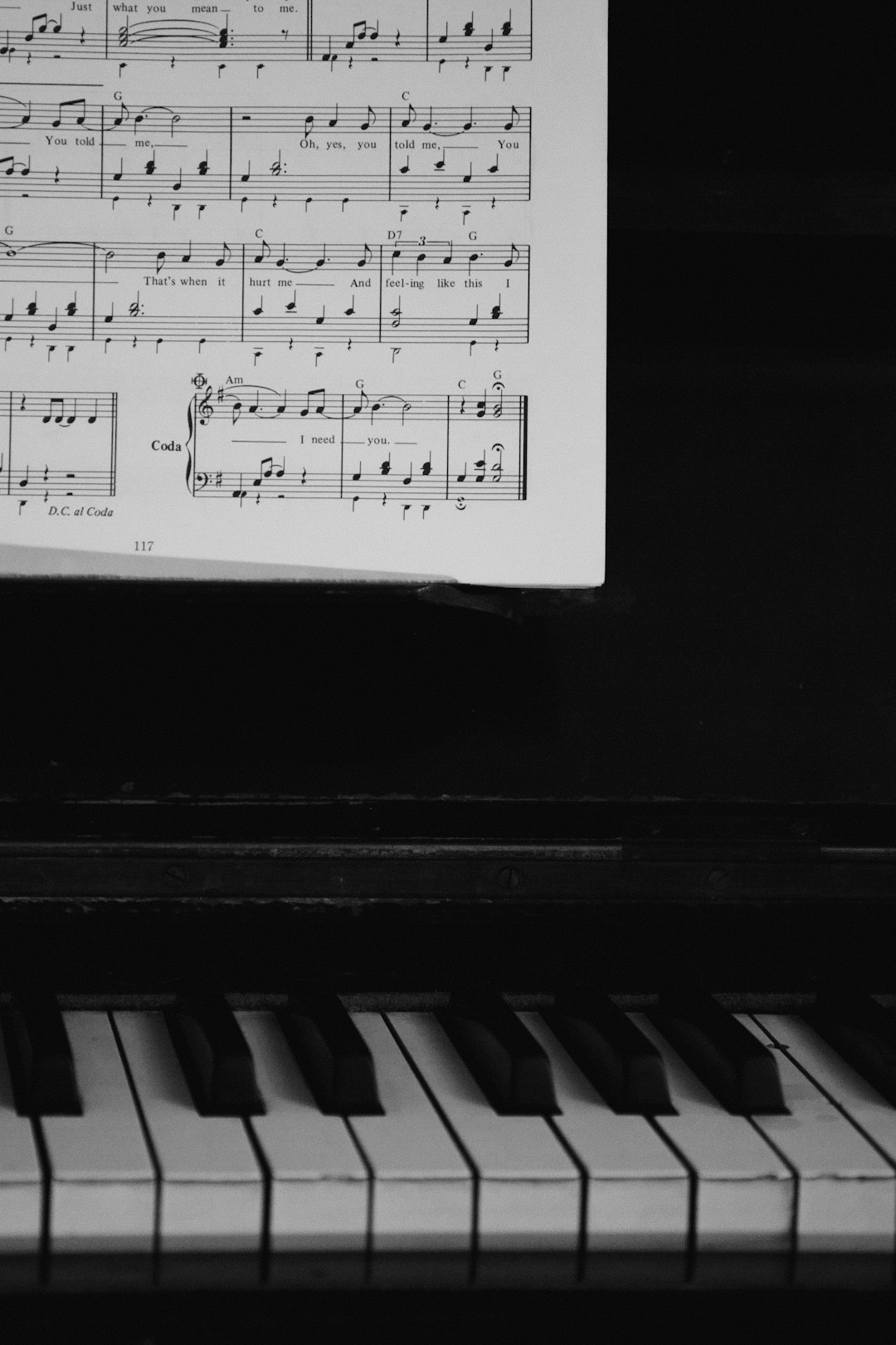 a-piano-with-sheet-music-on-it-15lau3embry